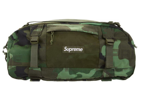SUPREME DUFFLE BAG WOODLAND CAMO FW21
